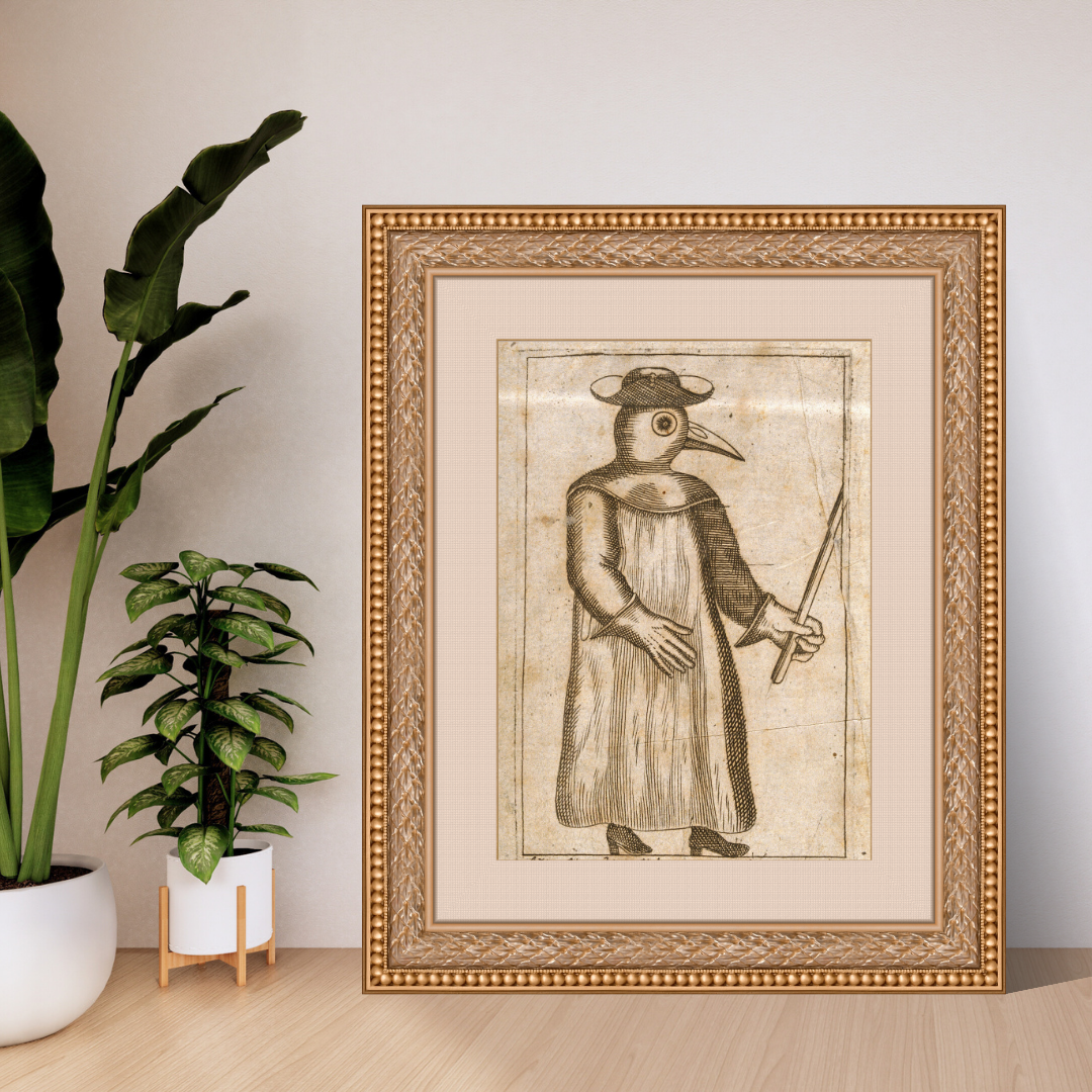 Framed artwork of a person in a long coat and hat with a long nose, standing next to a plant.